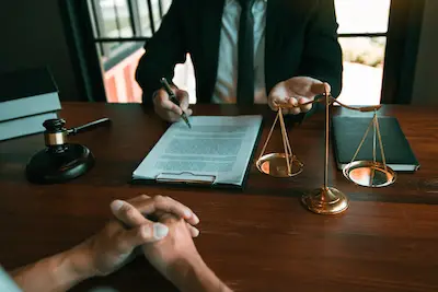 Lawyer advising client in office