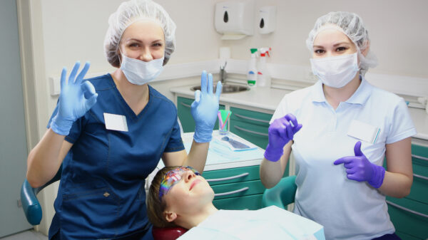 Dental team treating a patient in a modern clinic, representing the friendly and professional care offered by top 10 Tulsa dentist practices.